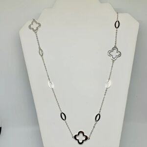 Elegant Silver Necklace with Clover Accents